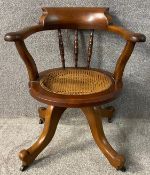 A 19th century mahogany swivel action captain's desk chair. H.76cm.