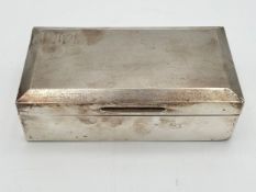 An Art Deco sterling silver cigarette box with an enamelled base and lined with a fitted cedar