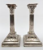 A pair of silver Corinthian column candlesticks, hallmarked Sheffield 1901, James Dixon and Sons