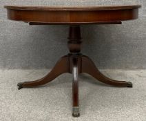 A Georgian style mahogany extending dining table with integrated leaf. H.73 W.112 (W.155 ext.) D.