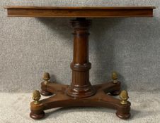 A mid 19th century mahogany reading or music stand with adjustable height mechanism on platform base