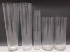 A collection of five large glass florist's vases. H.70 Dia.22cm