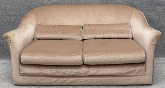 A contemporary two seater sofa bed. H.74 W.151 D.89cm.