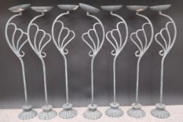 A collection of seven Art Deco style metal plant stands. H.72cm