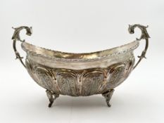 A continental repousse silver twin handled bowl, marked 900. H.17 W.29 D.14cm. Weight 532g.