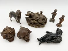 A collection of miscellaneous metal objects to include a pair of bronze grotesque door knobs, a
