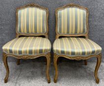 A pair of Louis XV style carved walnut salon chairs. H.91cm (each)