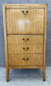 A mid century walnut Art Deco style drinks cabinet with a fall-front, opening to a mixing counter