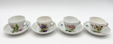 A set of four Meissen tea cups and saucers hand decorated with wild flowers. H.5 Dia.11cm.