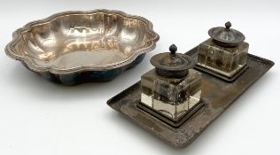 A silver plated desk stand with twin cut glass inkwells along with a silver plated bowl. Dia.27cm (