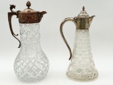 Two cut glass claret jugs one with hallmarked silver top marked WHL Birmingham, the other silver