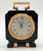 A Cartier Art Deco style black lacquer and gilt desk alarm clock, with its original box and