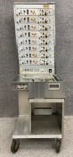 A mid century Grass Instrument Co. Model 5D polygraph machine or 'lie detector', with a main control