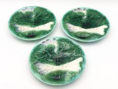 Three Majolica plates, C.1900 with leaf and asparagus design. Dia.24cm.