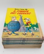 A collection of ten Asterix and Lucky Luke hardback comic books in French and two paperback Lucky