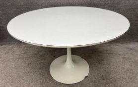 A vintage mid century white tulip table designed by Maurice Burke for Arkana, with a sprayed steel