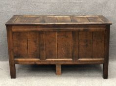 A country oak panelled coffer on stile supports with it's original hinges, possibly 17th century.