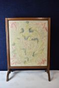 A C.1900 tapestry panel firescreen, glazed. H.78 W.56cm