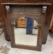 A mid century carved oak frame mirror. H.73 W.58cm
