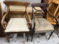 Two early 19th century mahogany open armchairs.