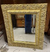 A Florentine style gilt framed mirror with a bevelled plate. H.78 W.66cm