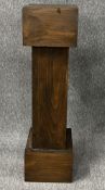 A stained pine pedestal. H.121 W.33 D.38cm