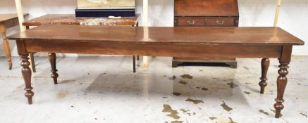 A mid 19th century mahogany refectory dining table on turned tapering supports. H.76 W.275 D.76cm