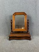A 19th century flame mahogany swing toilet mirror. H.78 W.64 D.30cm