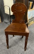 A 19th century mahogany hall chair.