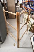 A C.1900 folding towel rail. H.112 W.76cm