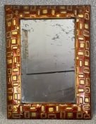 A contemporary retro styled wall mirror with a faux aged plate. H.103 W.78cm