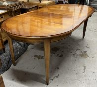A contemporary French cherrywood extending dining table with two extra leaves. H.77 W.110 D.110