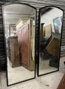 A pair of arched plate metal framed tall mirrors. H.151 W.60cm
