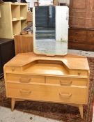 A mid century light oak G-Plan dressing table with maker's stamp. H.155 W.110 D.45cm