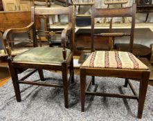 A Georgian mahogany armchair and a similar dining chair.