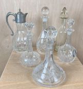 A collection of five 19th century and later cut glass decanters with stoppers along with a silver