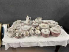 An extensive Luneville France dinner service, hand decorated and marked to base.