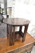 A nest of mid century mahogany graduating occasional tables