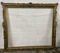 A large 19th century style carved giltwood and gesso picture frame. H.160 W.182cm