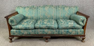 An early 20th century mahogany framed bergère sofa on carved ball and claw cabriole supports. H.79