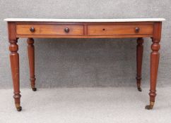 A 19th century mahogany marble topped writing table or washstand. H.76 W.122 D.66.5cm