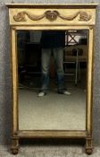 A 19th century painted and gilt pier mirror with neoclassical motifs, the frieze having a Medusa