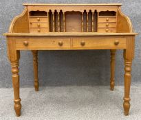 A 19th century style pine desk with fitted interior. H.108 W.109 D.65cm.