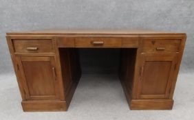 An Eastern teak twin pedestal desk. H.75 W.146 D.96cm