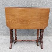 A 19th century walnut Sutherland occasional table with gate-leg action. H.55 W.15 extending to 64