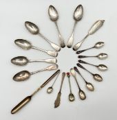 A miscellaneous collection of silver spoons and knives to include two marrow scoops, English