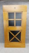 A contemporary fruitwood full height cabinet with composite laminate panel doors. H.203 W.105 D.42cm