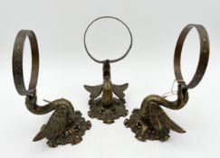 A set of three brass wall sconces in the form of geese holding rings in their beaks. H.10 W.11 D.