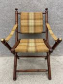 A 19th century style mahogany folding campaign chair with faux bamboo frame. H.101cm.