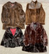A collection of four fur coats and shawls to include one mink by Saga, along with another mink coat,